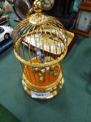 Clockwork Swiss musical singing bird in a brass cage