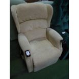 Beige electric operated recliner armchair