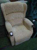 Beige electric operated recliner armchair