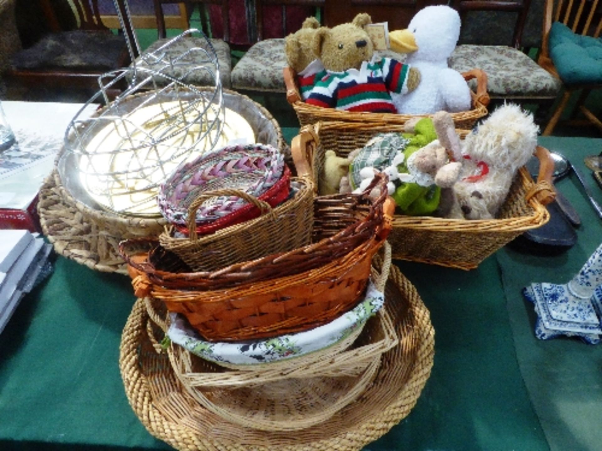 Qty of wicker baskets, soft toys, gold coloured plastic plates & a bottle carrier