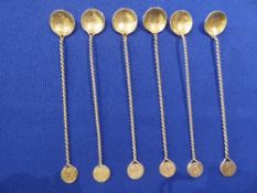 6 silver coloured metal long-handled small spoons with barley twist handles & coins to either end,