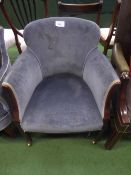 Mahogany framed blue velour type tub chair on castors