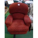 Rust pattern upholstered reclining armchair