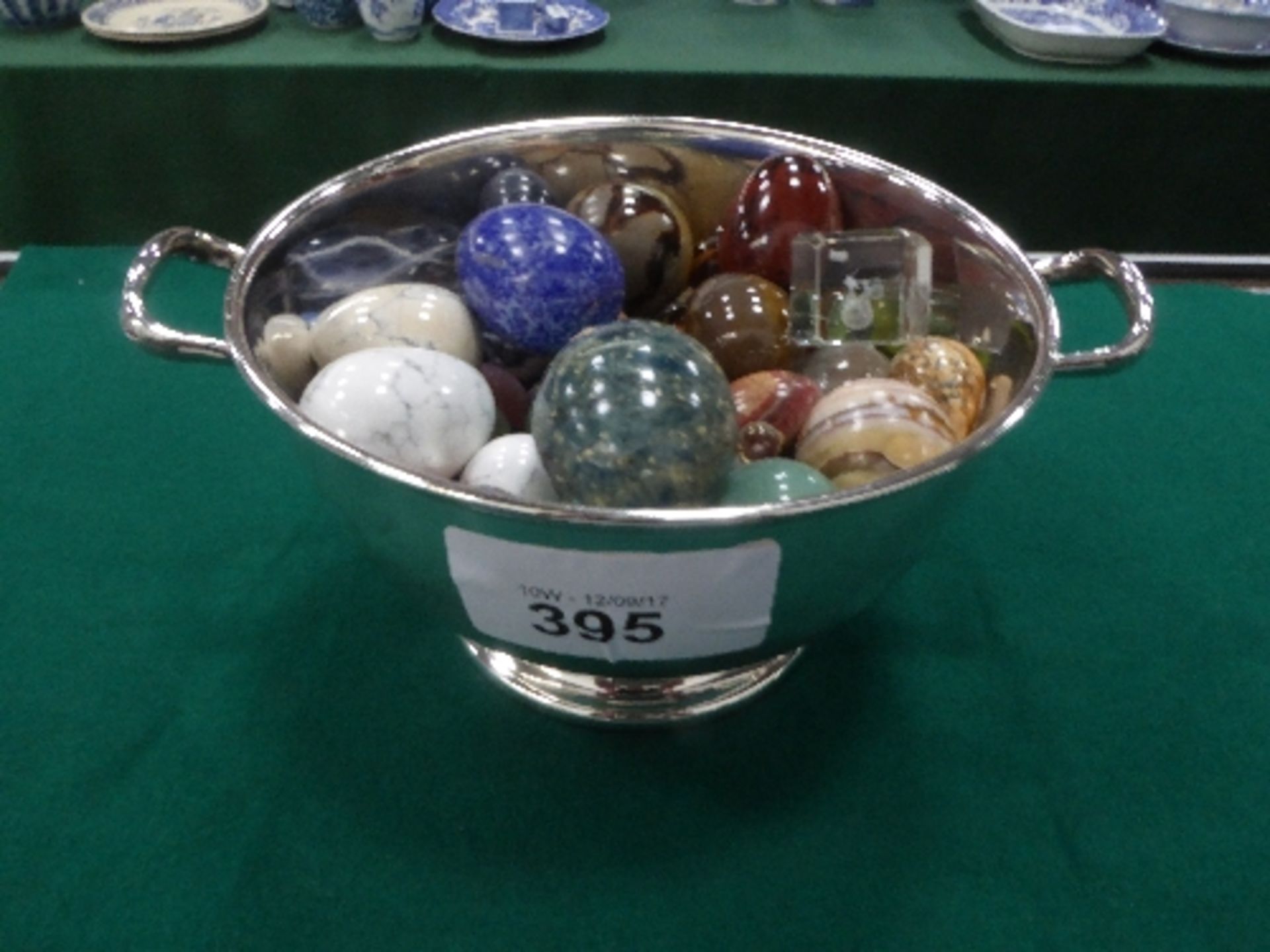 Silver plated 2 handled bowl, 7.75' diameter filled with polished stone eggs, marbles etc