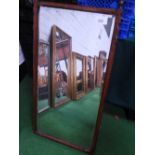 Oak framed wall mirror with finials, 38.5' x 20'