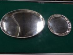 Silver plated oval tray on 4 ball feet with pierced upstand & a circular silver plated card tray,