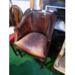 Brown leather tub chair on cabriole pad legs