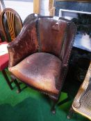 Brown leather tub chair on cabriole pad legs