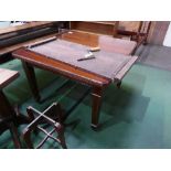 Mahogany wind-out dining table on square tapered inlaid legs on castors, 41' x 41' (closed) c/w
