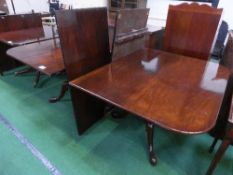 Mahogany D-end extendable dining table on heavy turned gun barrel supports to cabriole scrolled