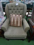 Button back upholstered armchair