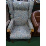 Beech framed wing back armchair with floral upholstery