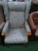 Beech framed wing back armchair with floral upholstery