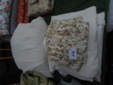 2 pairs of cream coloured curtains, a floral design curtain & a qty of cream coloured curtains