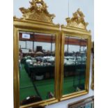 Pair of gilt wood bevel edge wall mirrors with ornate masks above, overall 42' x 17.5'