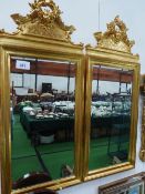 Pair of gilt wood bevel edge wall mirrors with ornate masks above, overall 42' x 17.5'