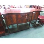 Mahogany serpentine sideboard with 2 centre drawers flanked by 2 cupboards on tapered legs, 60' x