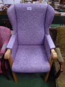 Purple coloured beech framed wing back armchair