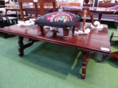 Chestnut occasional/coffee table on shaped support & wrought iron brackets, 58' x 38'