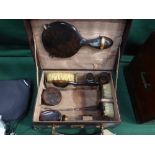 Tortoise shell-effect backed Gentleman's travelling toilet set in a leather case with initial H.H.