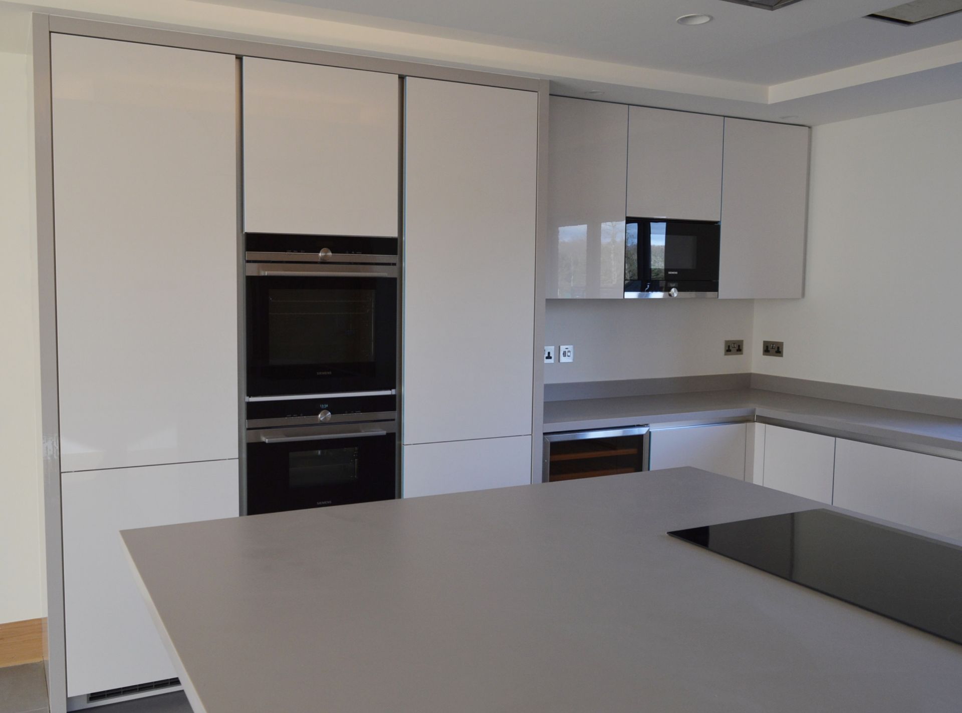 1 x Stunning KELLER Handleless FITTED KITCHEN With Corian Clay Worktops, Centre Island With - Image 9 of 104