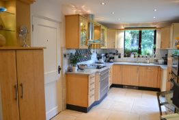1 x Contemporary Beech Fitted Kitchen Featuring Corian Worktops And Integrated Appliances From Neff,