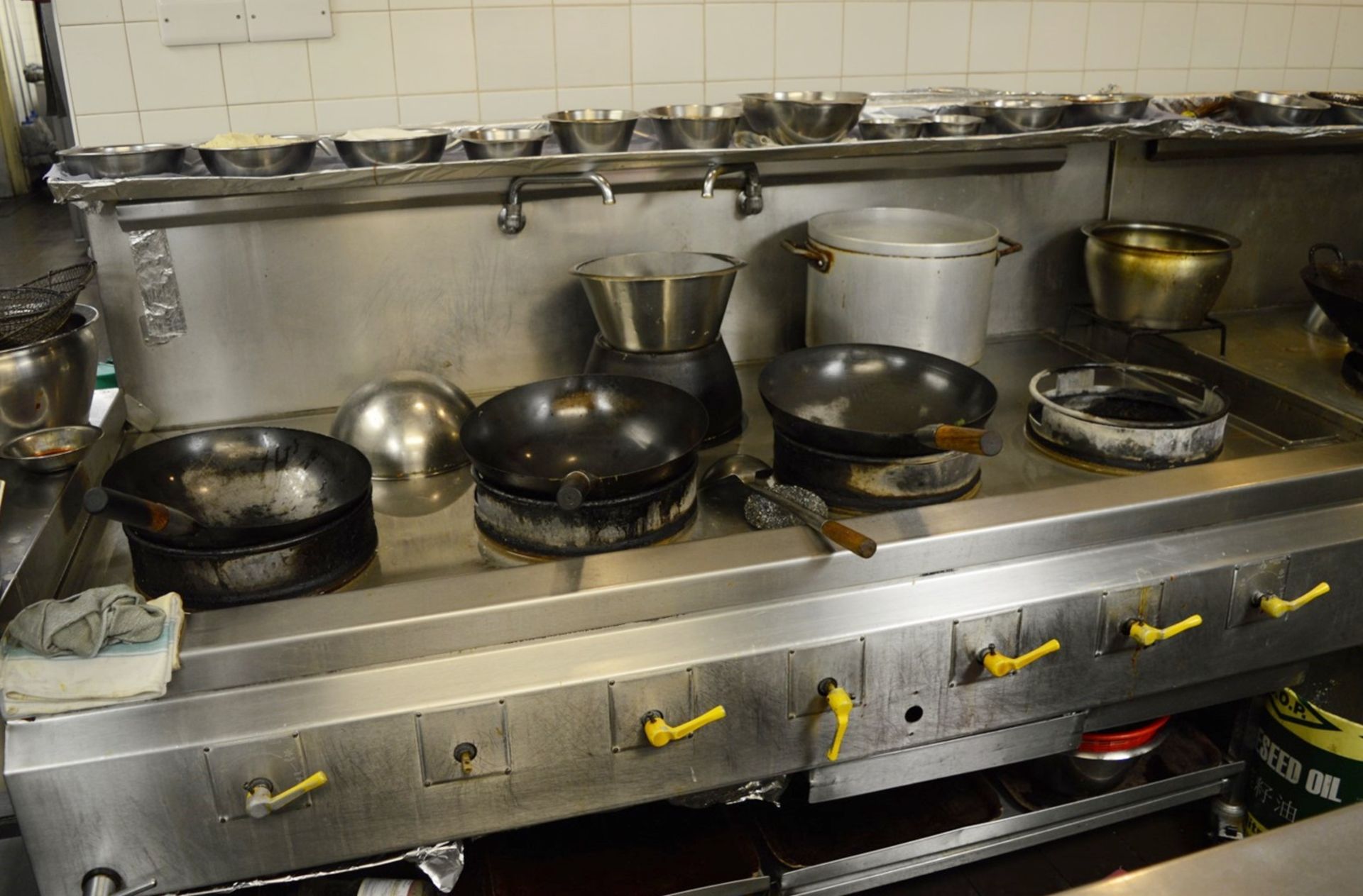 1 x Commercial Seven Burner Wok Station - Stainless Steel Finish - Features Castor Wheels and Over