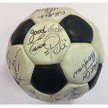 ESCAPE TO VICTORY: An excellent black and white leather football individually signed by eleven
