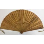 THEATRE: A wooden handheld fan featuring a painted decoration of several individuals in traditional