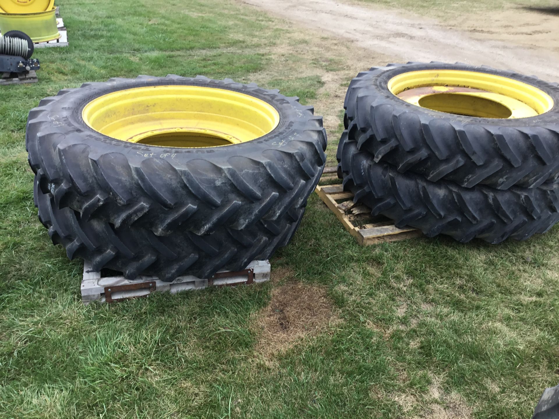 1 SET OF 4 GOODYEAR 480/80R50 TIRES ON 12 HOLE OPEN CENTER RIMS