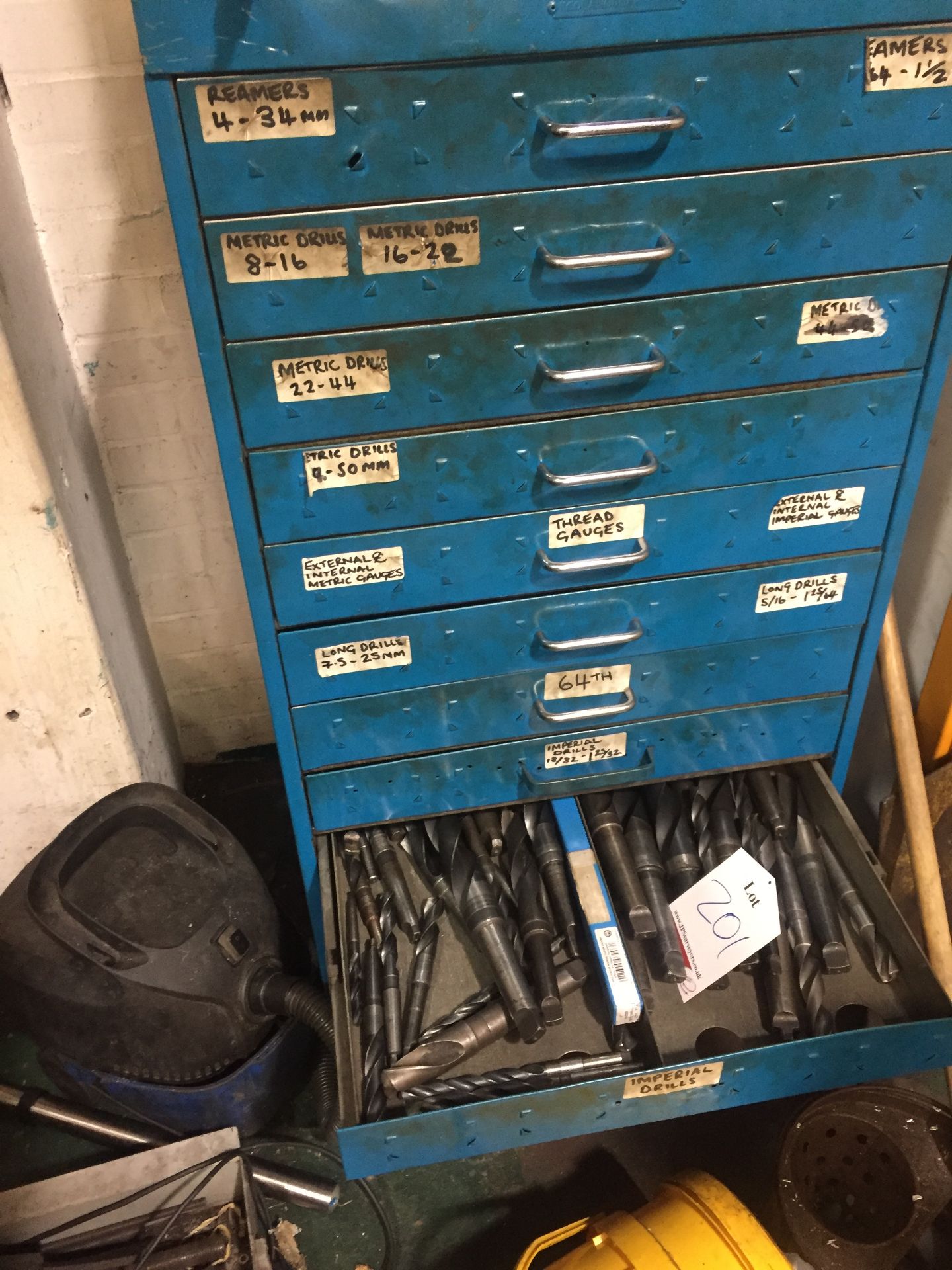 12 drawer tool cabinet containing reamers, drills, etc.