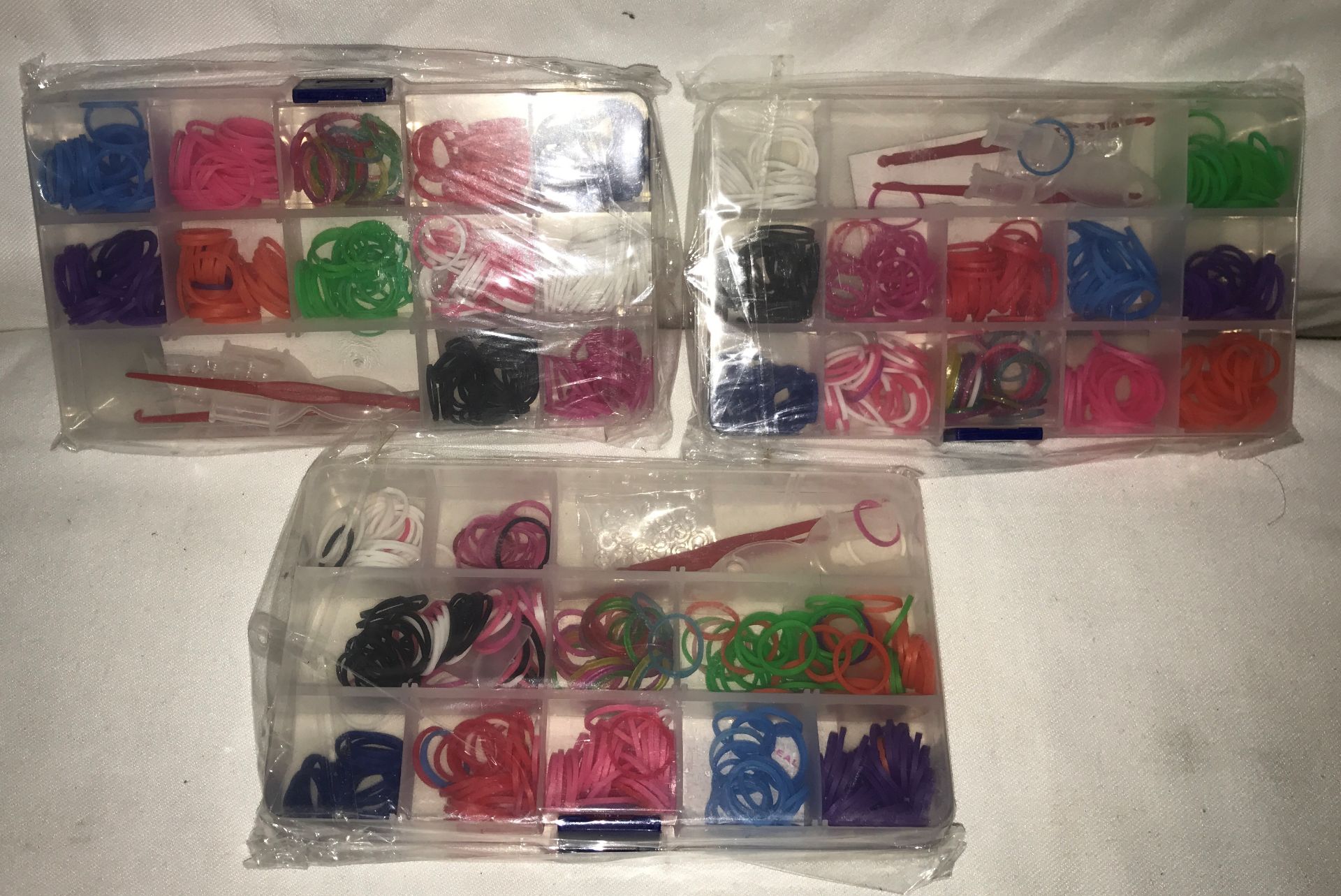 Box containing large quantity of loom bands