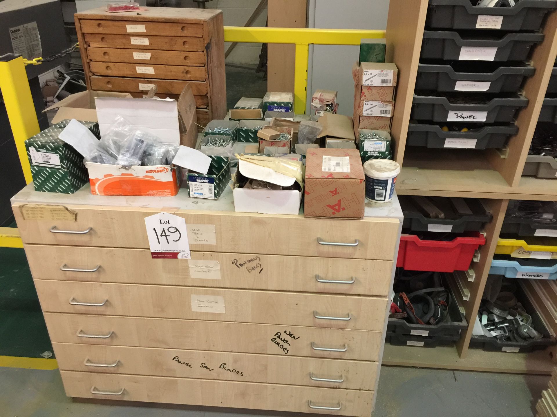 Large quantity of fasteners, saw blades, hinges, masks, etc in 1 chest and 2 racks