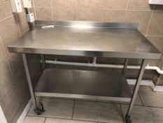 Stainless steel food preparation table 120 x 64 cm with backsplash and undershelf on castors