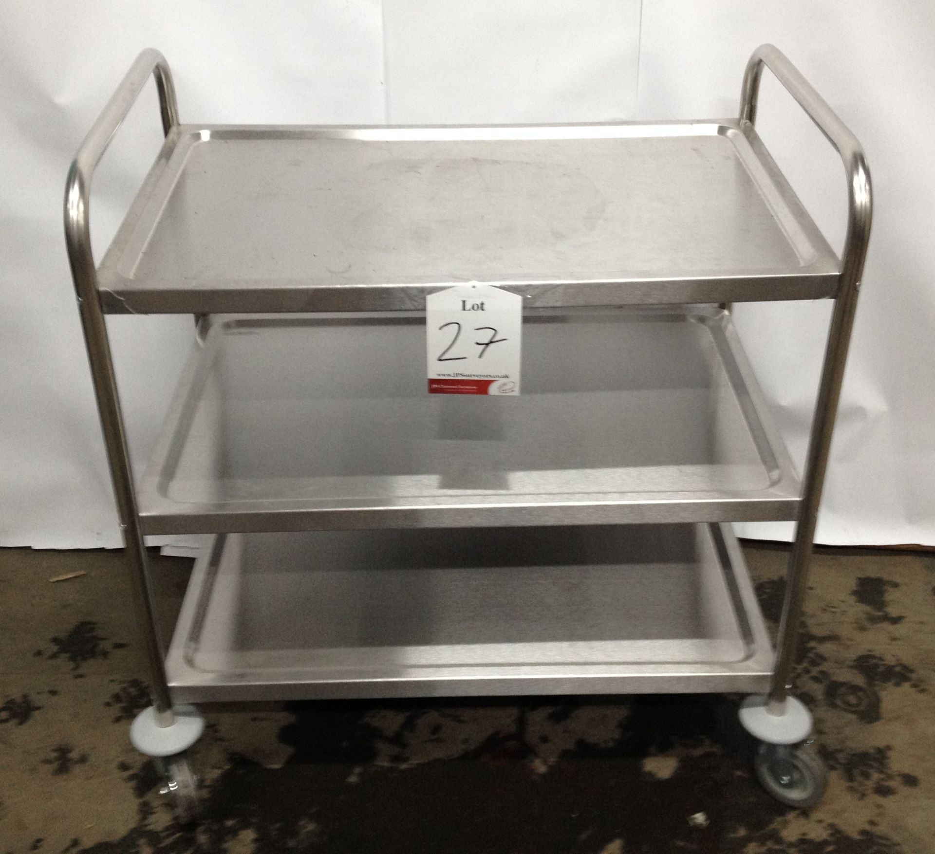 Stainless steel wheeled table with 3 shelf surfaces