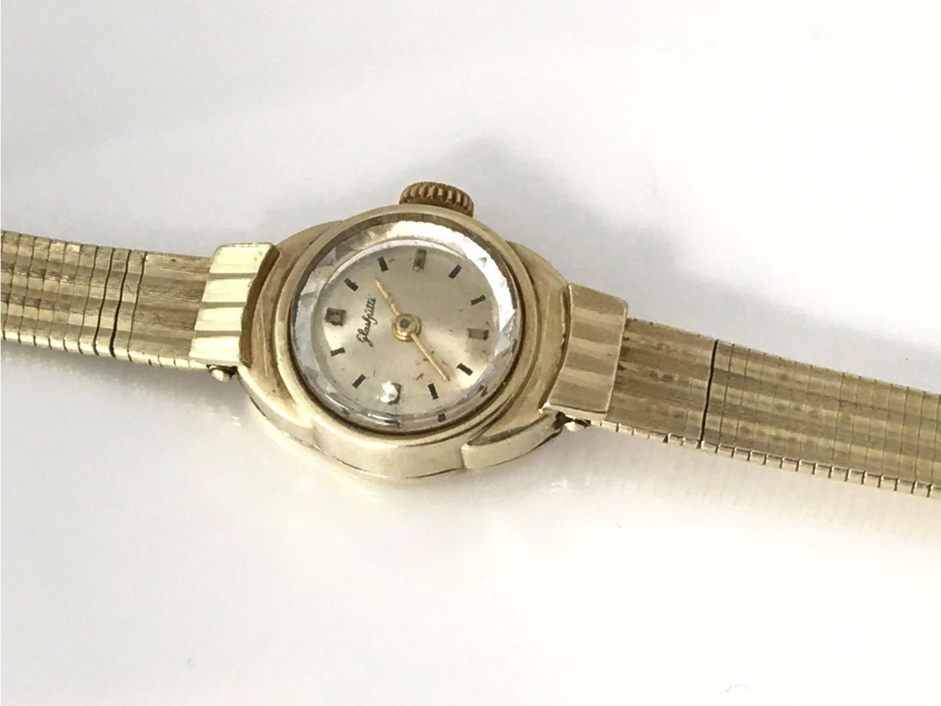 Armbanduhr: goldene Damenuhr, Glashütte, um 1950 Ca. 17cm lang, durch die flexible Schließe auf