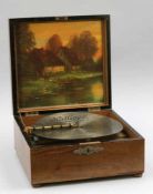 Polyphon "Kalliope" mit 10 Glocken Polyphon with 10 bells and 14 disc records Um 1900. Holz. 18,5