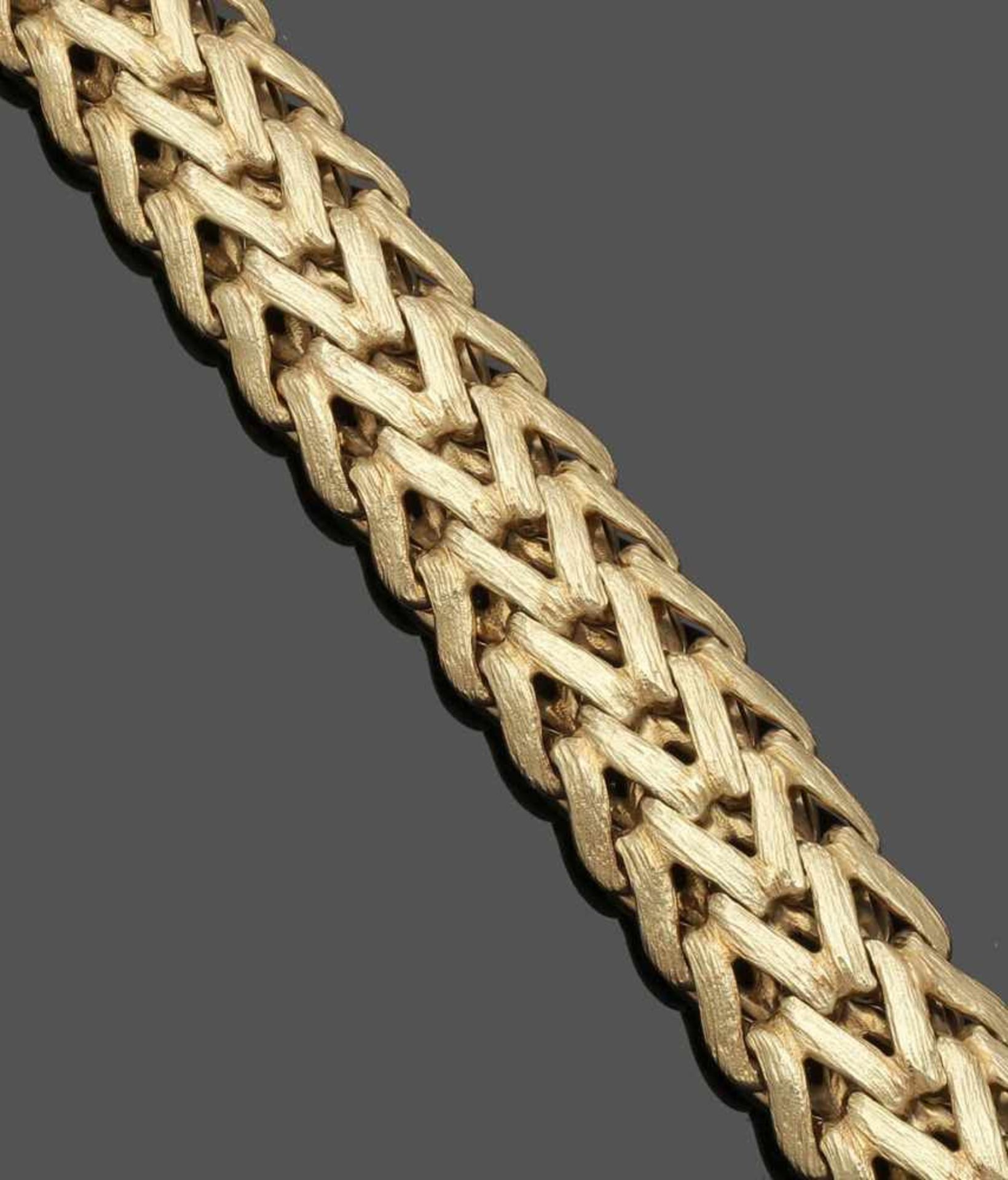 Massives Goldarmband A solid golden bracelet 585er GG, gestemp. L. 20,8 cm. B. 2,2 cm.