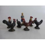 7 Massefiguren um 1920, Mädchen mit Futtertasche und 6 Hühner, tlw. min. besch., h. v. 5,5cm - 9,