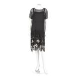 Two black beaded flapper dresses, late 1920s, one of chiffon with scalloped hem, original slip,