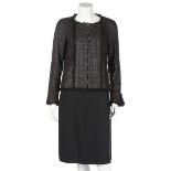 A Chanel black tweed jacket, 2005, labelled and size 38, with paint effect check, diamante buttons,