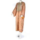 A brocaded peach satin robe, Moroccan, early 20th century,