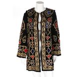 An embroidered black velvet jacket, North African for the European market, 1900s, with red,