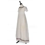 A muslin dress, 1800-10, empire-line with purple wool embroidered borders, pin-tucked short sleeves,