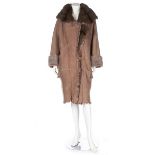 A Fendi sheepskin coat, probably 1990s, unlabelled but with Fendi marked button, with fur collar,