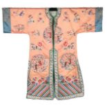 A woman's embroidered orange satin informal robe, Chinese, late 1920s-30s,