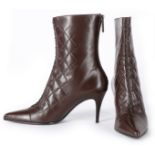 A pair of unworn Chanel calf boots, modern, of brown leather,