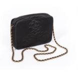 A Chanel black satin shoulder bag, 1990s, stamped to interior, with quilted camellias to exterior,