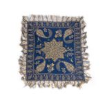 An embroidered blue wool Rescht cover, circa 1850,