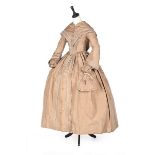 A beige silk taffeta day dress with matching pelerine, late 1840s,